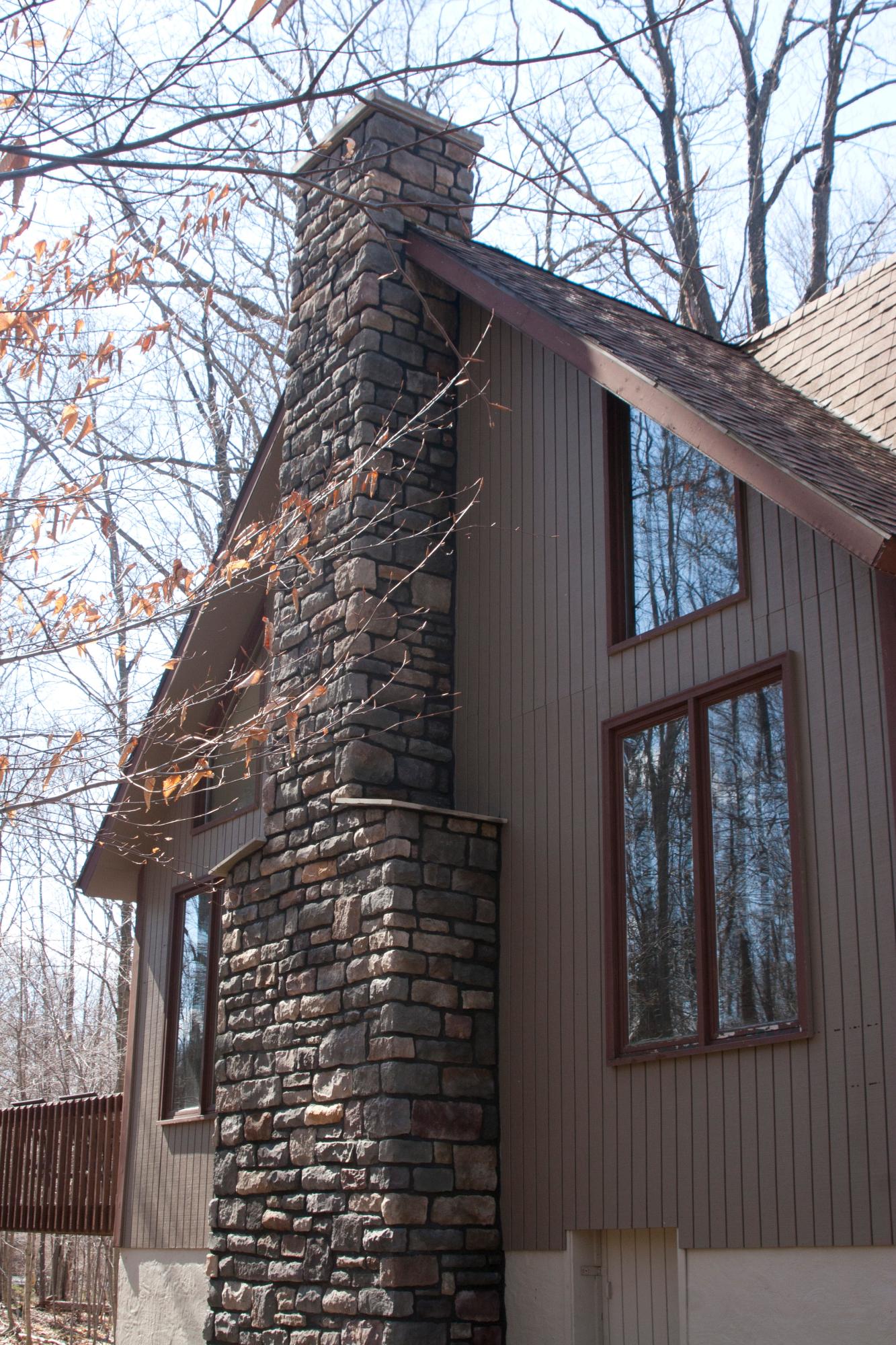 Cut stone chimney, dark mortar